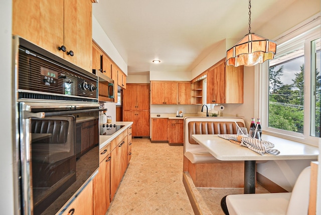 2033 S Rebecca St, Spokane, WA 99223 - kitchen with black appliances, open shelves, light countertops, decorative light fixtures, and a sink