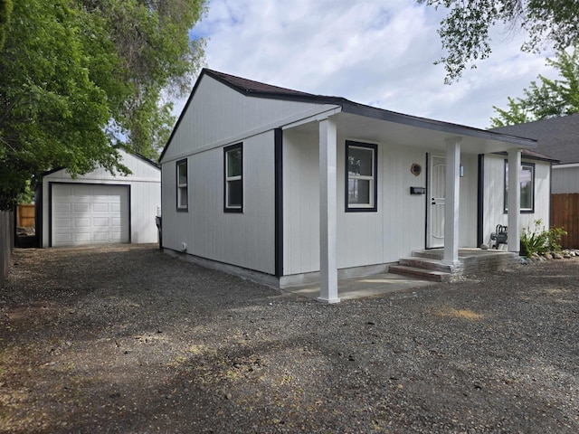 3019 E Augusta Ave, Spokane, WA 99207 - view of front of home featuring driveway, an outbuilding, a detached garage, and fence