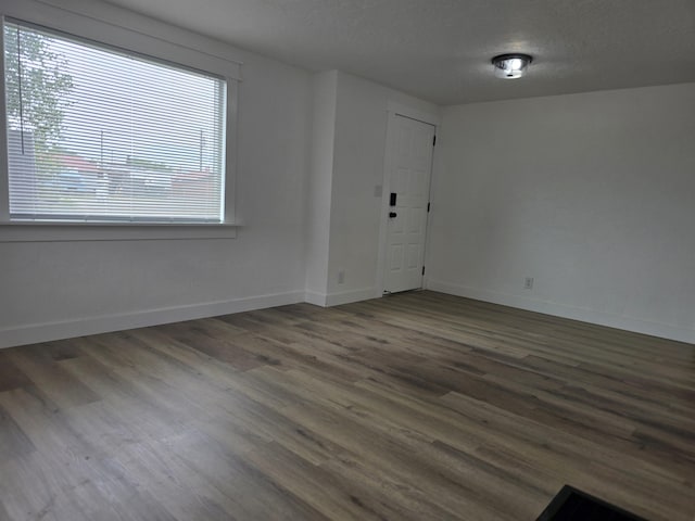 3019 E Augusta Ave, Spokane, WA 99207 - entryway featuring wood finished floors, baseboards, and a textured ceiling