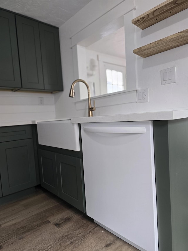 3019 E Augusta Ave, Spokane, WA 99207 - kitchen with dishwasher, dark wood-type flooring, light countertops, a sink, and open shelves