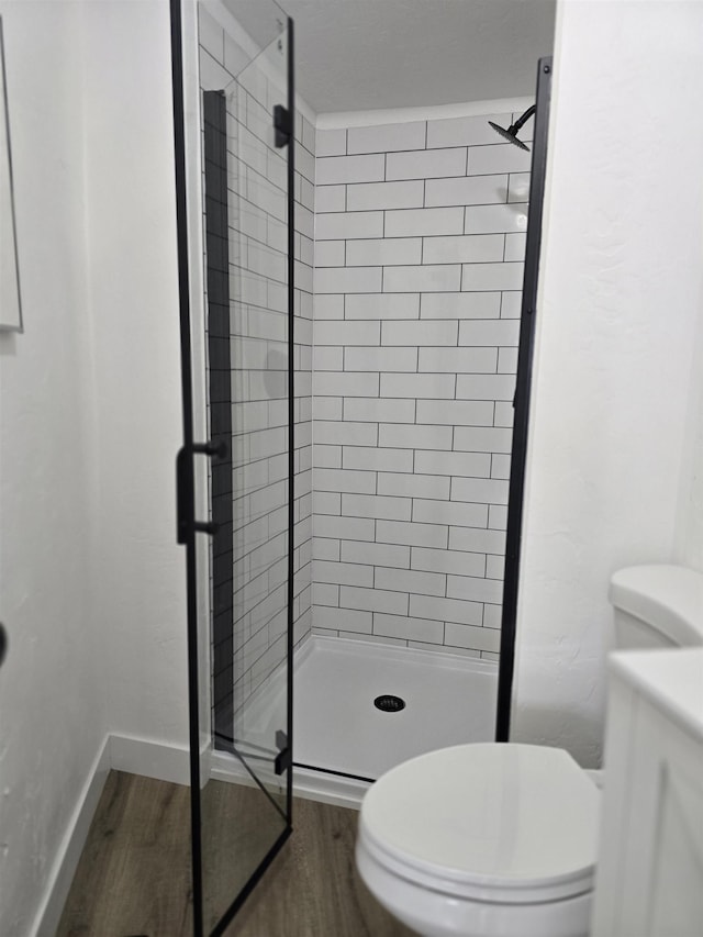 3019 E Augusta Ave, Spokane, WA 99207 - full bathroom featuring a shower stall, toilet, wood finished floors, and vanity