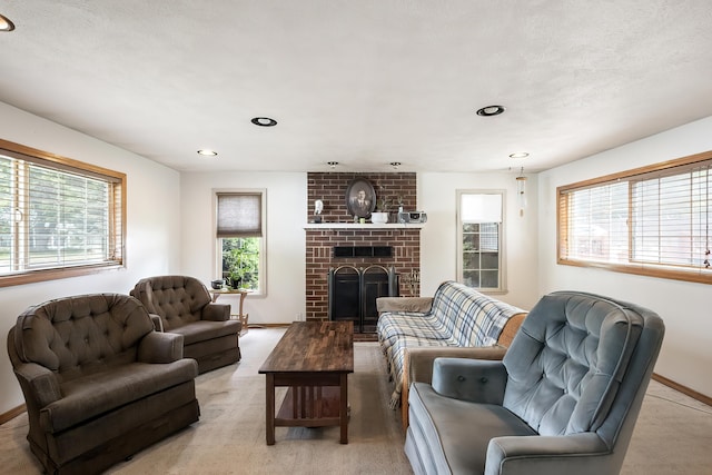 living room with a brick fireplace, recessed lighting, and baseboards
