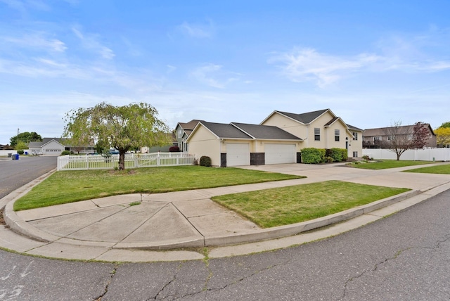 3821 W Teiton Ave, Spokane, WA 99208 - view of front of house with a garage, concrete driveway, and a residential view