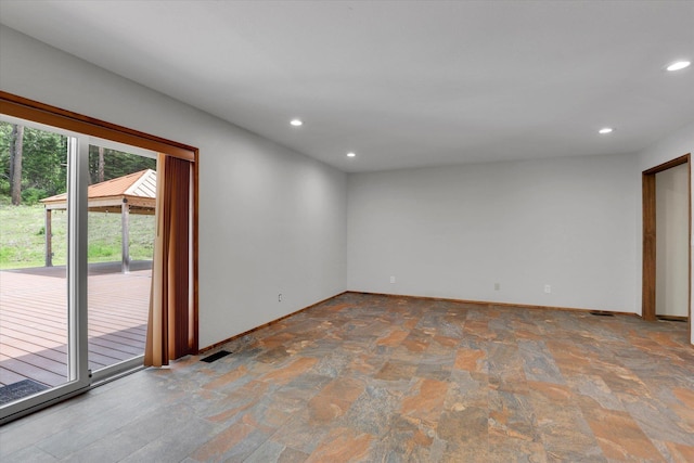 30915 N Chipmunk Rd, Chattaroy, WA 99003 - spare room featuring stone finish flooring, recessed lighting, and baseboards