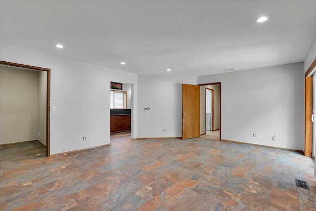 30915 N Chipmunk Rd, Chattaroy, WA 99003 - unfurnished room featuring light stone finish flooring, baseboards, and recessed lighting