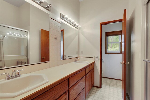 30915 N Chipmunk Rd, Chattaroy, WA 99003 - bathroom with tile patterned floors, a shower stall, and double vanity
