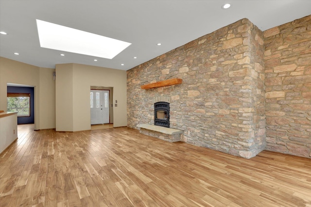 30915 N Chipmunk Rd, Chattaroy, WA 99003 - unfurnished living room with light wood-type flooring, a skylight, and recessed lighting