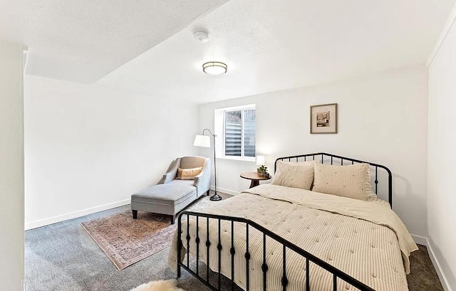 carpeted bedroom featuring baseboards
