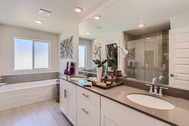 3029 S Coulter Ln, Spokane Valley, WA 99037 - full bath with plenty of natural light, a shower stall, a bath, double vanity, and recessed lighting