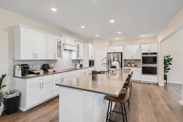 3029 S Coulter Ln, Spokane Valley, WA 99037 - kitchen with a sink, stainless steel appliances, backsplash, white cabinetry, and recessed lighting