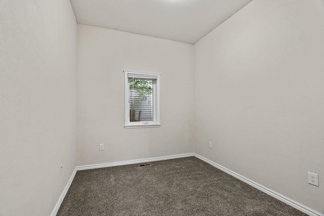 2212 W Gardner Ave, Spokane, WA 99201 - unfurnished room featuring dark carpet and baseboards