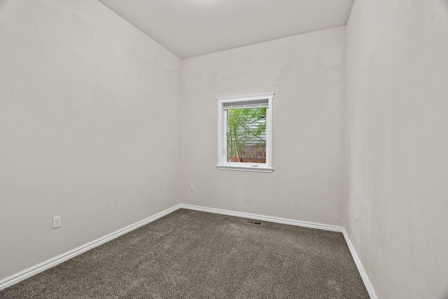 2212 W Gardner Ave, Spokane, WA 99201 - spare room with dark colored carpet and baseboards