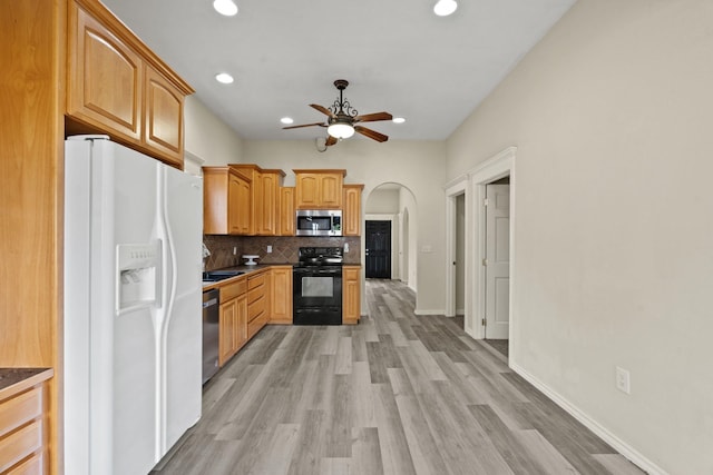 2212 W Gardner Ave, Spokane, WA 99201 - kitchen featuring stainless steel appliances, a ceiling fan, decorative backsplash, recessed lighting, and light wood finished floors