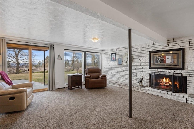2311 W Wedgewood Ave, Spokane, WA 99208 - living area featuring carpet flooring, a warm lit fireplace, and a textured ceiling