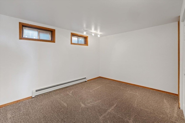 2311 W Wedgewood Ave, Spokane, WA 99208 - below grade area with a baseboard heating unit, rail lighting, carpet, and baseboards