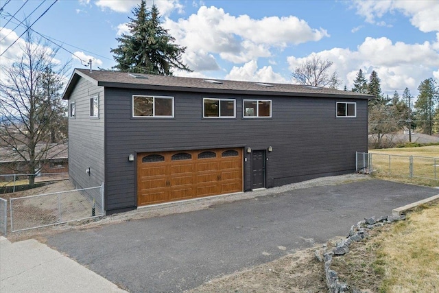 2311 W Wedgewood Ave, Spokane, WA 99208 - view of front facade featuring fence and asphalt driveway