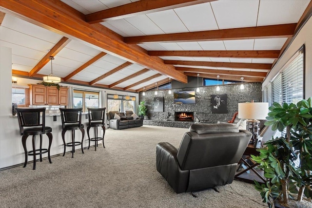 2311 W Wedgewood Ave, Spokane, WA 99208 - carpeted living area featuring a warm lit fireplace and plenty of natural light