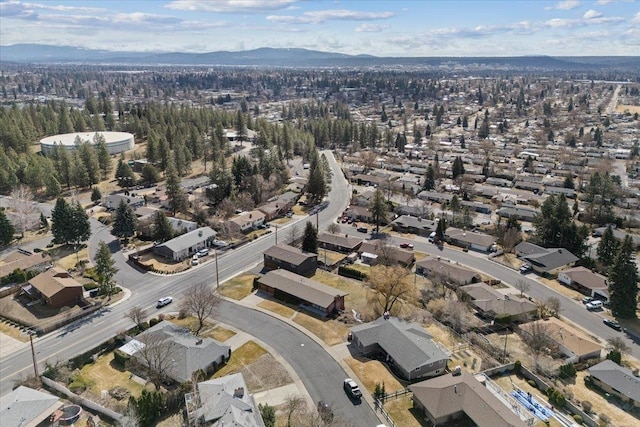 2311 W Wedgewood Ave, Spokane, WA 99208 - aerial overview of property's location featuring a mountain backdrop and nearby suburban area