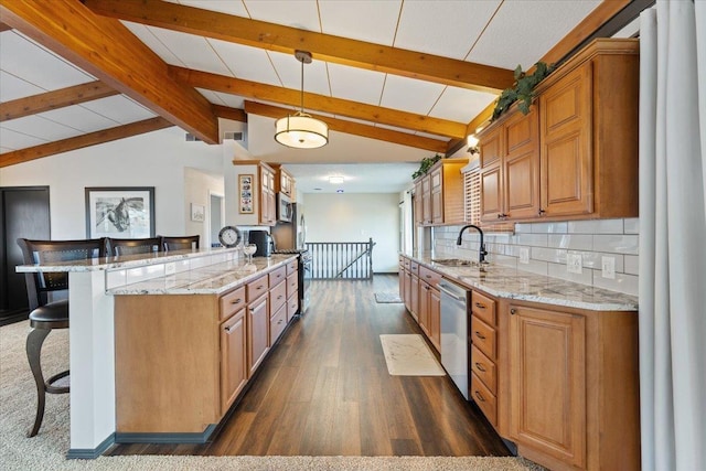 2311 W Wedgewood Ave, Spokane, WA 99208 - kitchen featuring stainless steel appliances, a breakfast bar area, a sink, dark wood-style flooring, and light stone counters