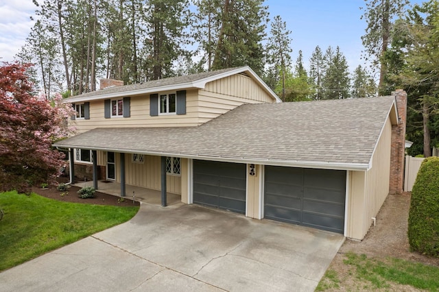 1610 E 35th Ave, Spokane, WA 99203 - view of front of house featuring a chimney, a garage, a shingled roof, and a porch