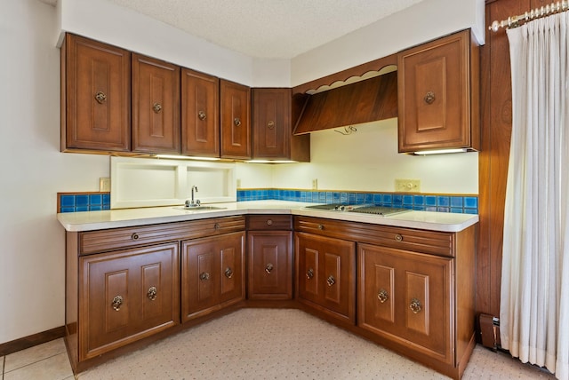 1610 E 35th Ave, Spokane, WA 99203 - kitchen featuring a sink, light countertops, and brown cabinetry