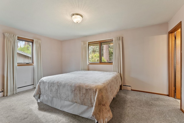 1610 E 35th Ave, Spokane, WA 99203 - carpeted bedroom featuring baseboard heating and baseboards