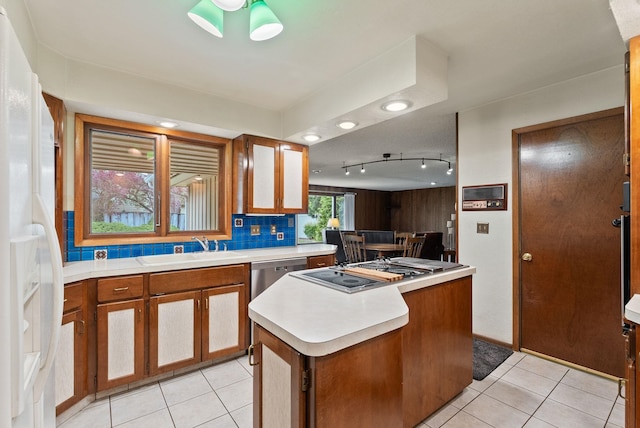 1610 E 35th Ave, Spokane, WA 99203 - kitchen featuring a sink, white refrigerator with ice dispenser, light countertops, light tile patterned floors, and recessed lighting