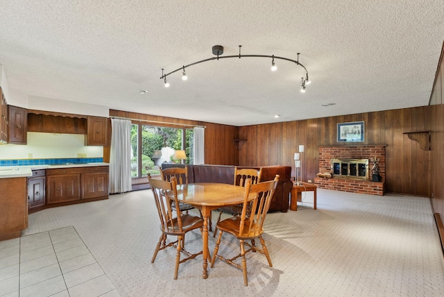 1610 E 35th Ave, Spokane, WA 99203 - dining space featuring a brick fireplace and wooden walls