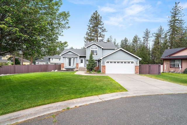 7421 W Lanzce Ct, Nine Mile Falls, WA 99026 - view of front facade with brick siding, an attached garage, driveway, and a gate
