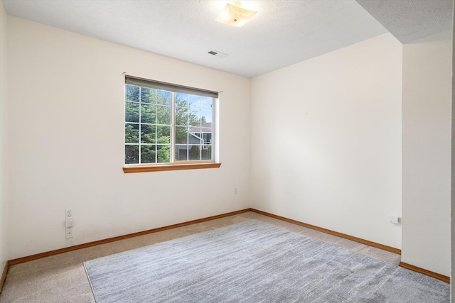 7421 W Lanzce Ct, Nine Mile Falls, WA 99026 - carpeted spare room featuring baseboards and a textured ceiling