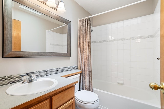 7421 W Lanzce Ct, Nine Mile Falls, WA 99026 - full bathroom featuring shower / bath combo with shower curtain, toilet, decorative backsplash, and vanity