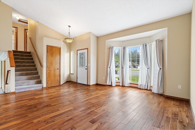 7421 W Lanzce Ct, Nine Mile Falls, WA 99026 - entryway with hardwood / wood-style flooring, stairway, baseboards, and lofted ceiling