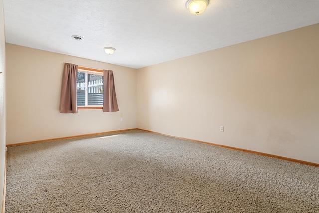 7421 W Lanzce Ct, Nine Mile Falls, WA 99026 - spare room featuring carpet floors and baseboards