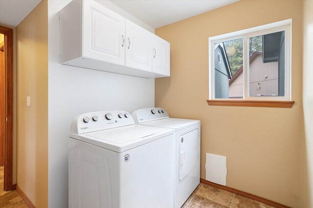 7421 W Lanzce Ct, Nine Mile Falls, WA 99026 - laundry room with washing machine and dryer, cabinet space, and baseboards