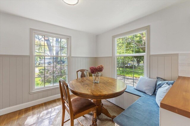1421 N Sunderland Rd, Spokane Valley, WA 99206 - dining area featuring wainscoting, wood finished floors, and plenty of natural light