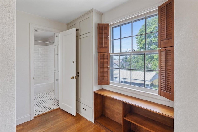 1421 N Sunderland Rd, Spokane Valley, WA 99206 - hallway featuring plenty of natural light, light wood finished floors, and a textured wall