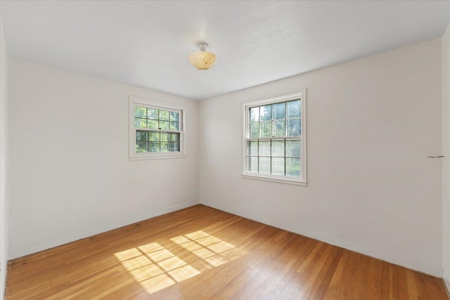 1421 N Sunderland Rd, Spokane Valley, WA 99206 - spare room featuring light wood-style flooring and baseboards
