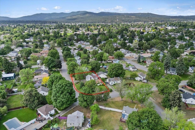 1421 N Sunderland Rd, Spokane Valley, WA 99206 - aerial perspective of suburban area featuring a mountainous background and property boundaries highlighted