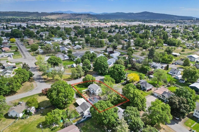 1421 N Sunderland Rd, Spokane Valley, WA 99206 - aerial perspective of suburban area with property boundaries highlighted and a mountainous background