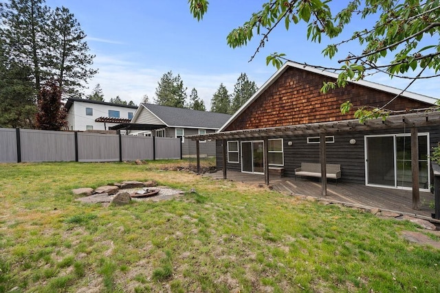 view of yard with an outdoor fire pit and a wooden deck