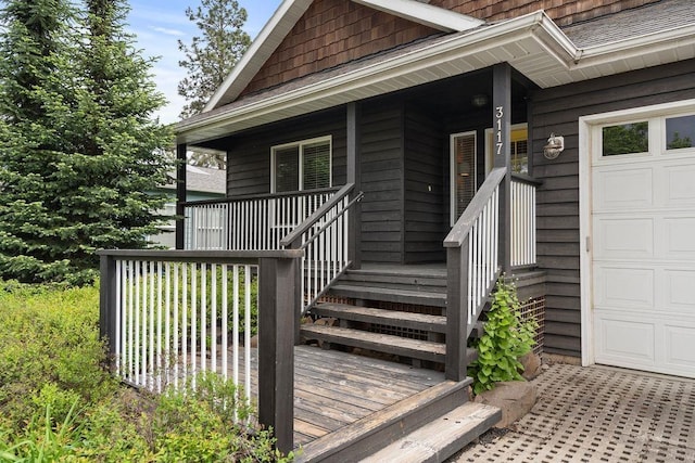 view of exterior entry with covered porch
