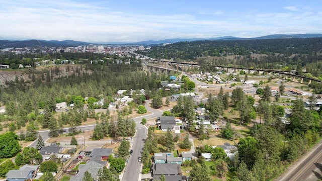 view of property location featuring mountains and a forest