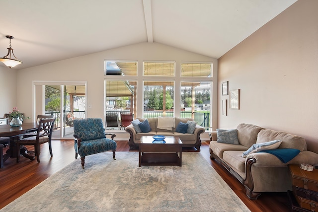 living room with beamed ceiling, wood finished floors, and high vaulted ceiling