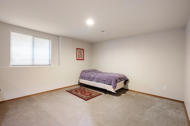 carpeted bedroom with baseboards