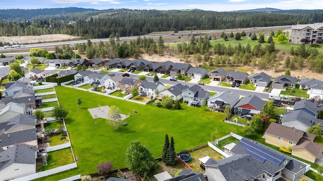 aerial view of residential area with a heavily wooded area