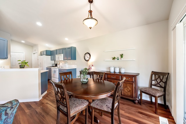 dining room featuring dark wood-style floors, baseboards, vaulted ceiling, and recessed lighting