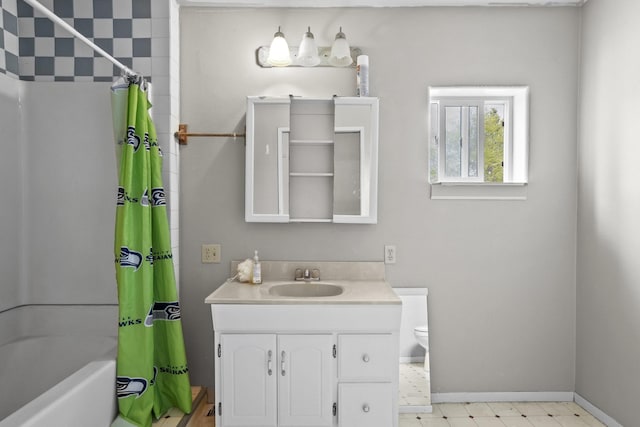 14203 E Belmont Rd, Mica, WA 99023 - full bathroom with baseboards, toilet, shower / bath combo, and vanity