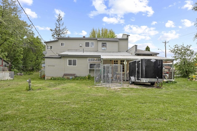 14203 E Belmont Rd, Mica, WA 99023 - back of property with a sunroom, a chimney, and a yard