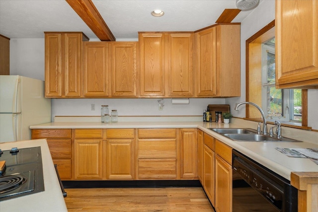 5217 E Stoughton Rd, Valleyford, WA 99036 - kitchen featuring freestanding refrigerator, dishwasher, a sink, light countertops, and light wood finished floors