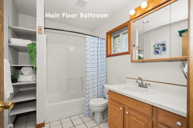 5217 E Stoughton Rd, Valleyford, WA 99036 - bathroom with tile patterned floors, toilet, vanity, and shower / tub combo